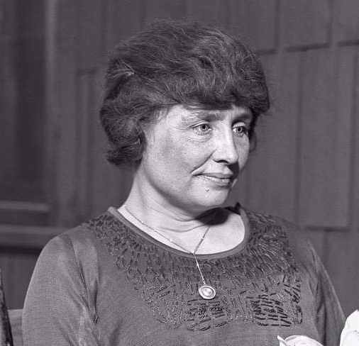 Black and white photograph of Helen Keller's face, showing her serene expression and strong features.